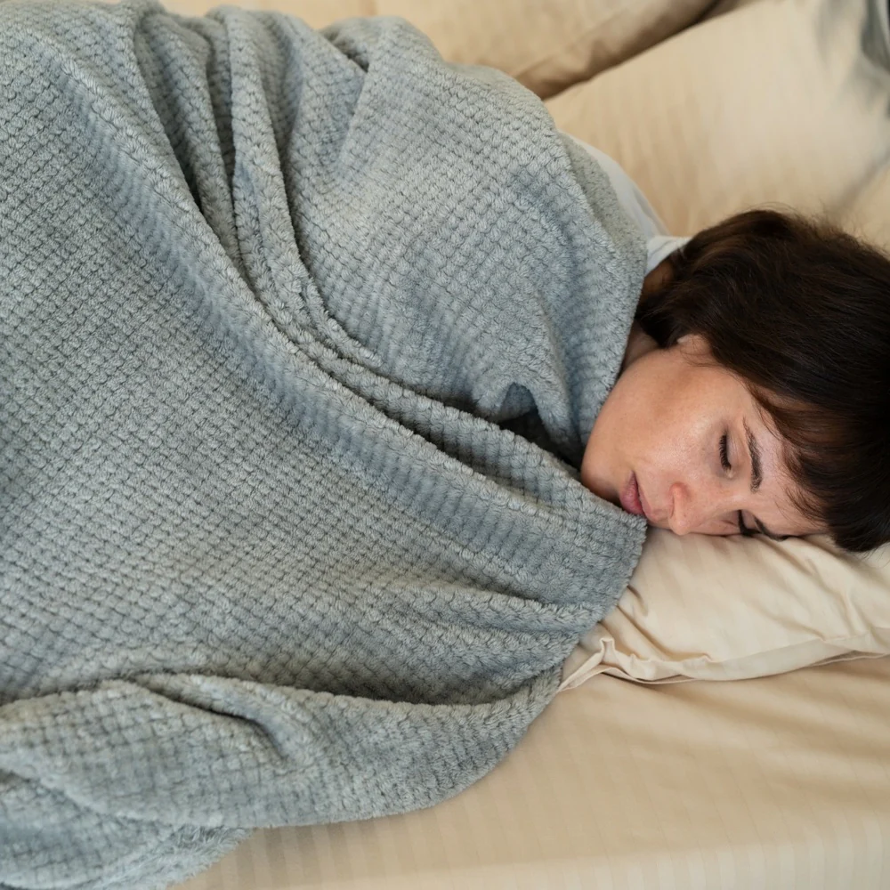 Sleeping With A Deceased Loved One’s Blanket? What That Comfort Habit May Really Mean